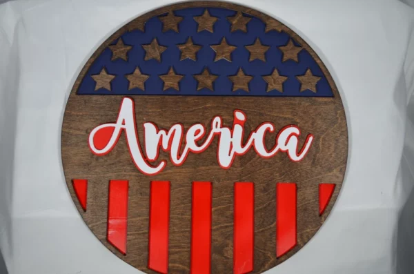 patriotic wood sign featuring "America"