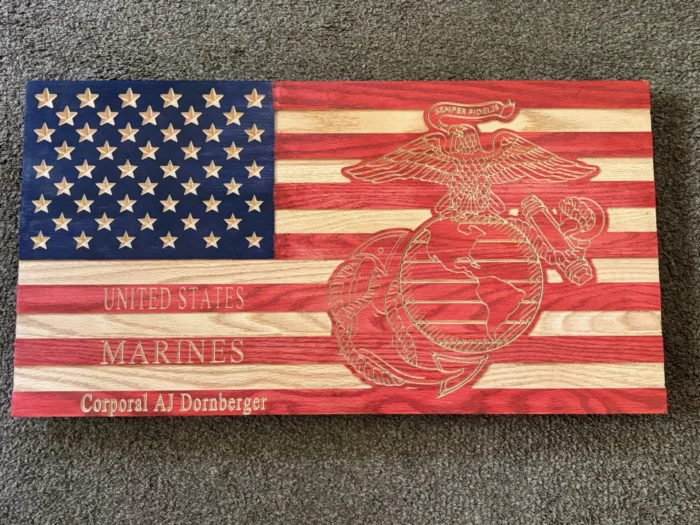 a wood flag with a us marine corps emblem